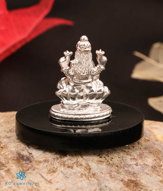 Back view of 999 silver Lakshmi idol on resin platform, ideal for decor or puja.